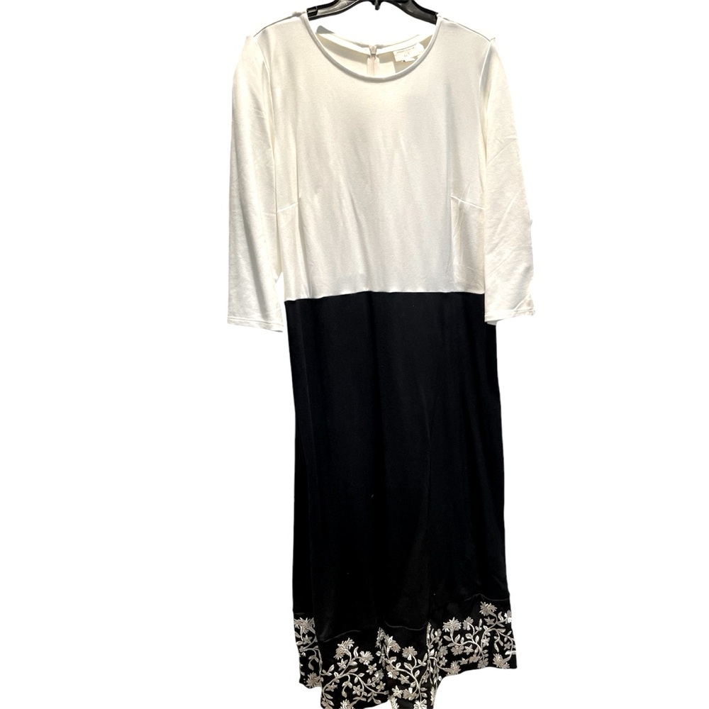Black and white dress with silver and white floral embroidery at hem